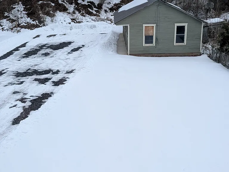 Tenant parking is included in rent. Garages can be rented separately for parking/storage (photo taken January 2026)