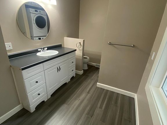 Main Floor full bath with stackable washer/dryer