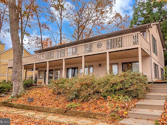 Home as seen from Lake, 2 decks, patio and dock