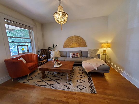 Living room with hardwood and large window