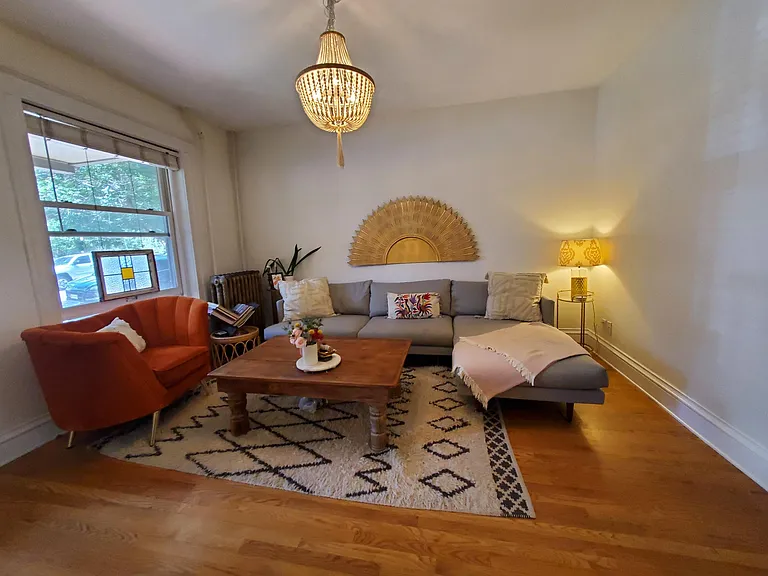 Living room with hardwood and large window