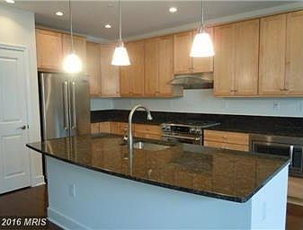 Great kitchen with an island for entertaining with upgraded appliances