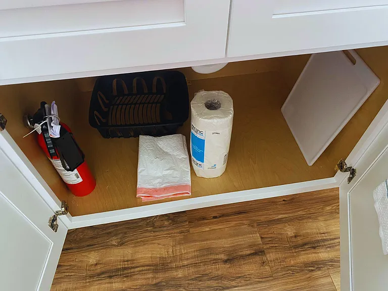 Equipped with cutting board, fire extinguisher, plastic bags, and disposable paper towels.