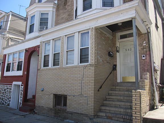 Semi-attached Brick legal 3-family on East Third