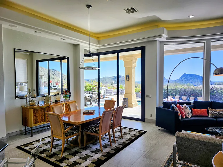 Slide the 10 ft stacking doors open to enjoy the sound of birds and waterfall while you dine or play cards.