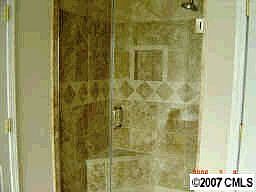 Stone shower w/ glass door