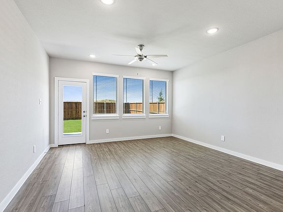 Living room in the Willow home plan by Trophy Signature Homes - REPRESENTATIVE PHOTO