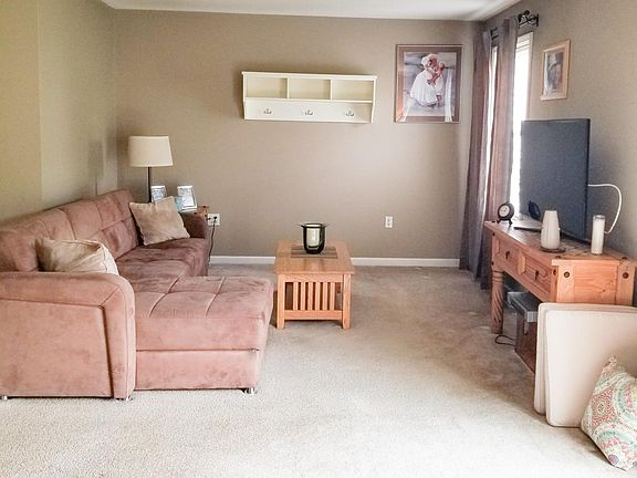 Large living room open to the kitchen with sliding doors to the back yard patio.