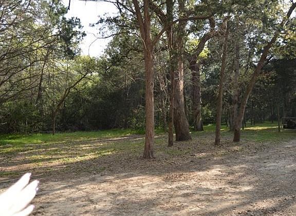 If standing in front of the home to your left is all woods.......