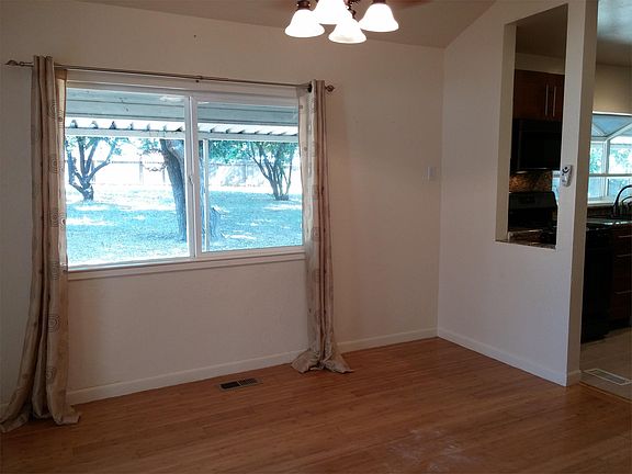 Dining room off kitchen with view of expansive back yard.