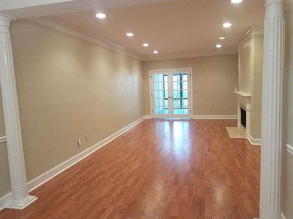 Main living space with fireplace that leads to Dining room and the sunroom!