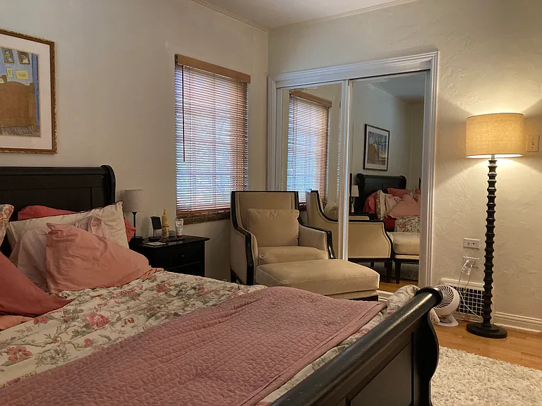 Master Bedroom with Queen Size Bed, sitting area with sliding mirrored closet doors