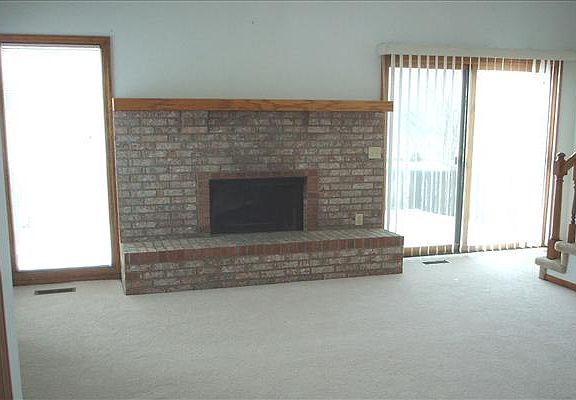 Living room with wood burning fireplace