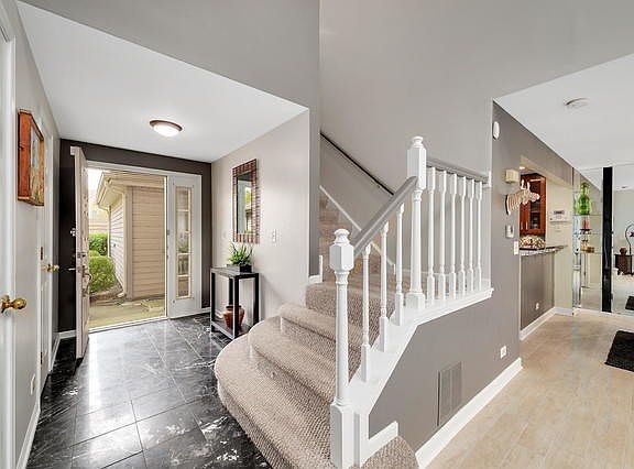 Entryway isEmser Black and white Polished Marble with a 3 x 3 foot entry closet