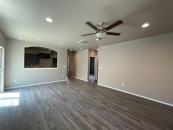 Living room, dining area and kitchen entry
