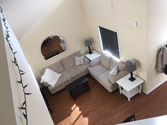 Looking down on the living room from the second floor loft.
