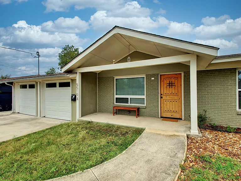 Two car garage and front door