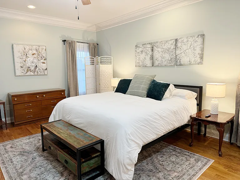Separated master bedroom is spacious and stylish.