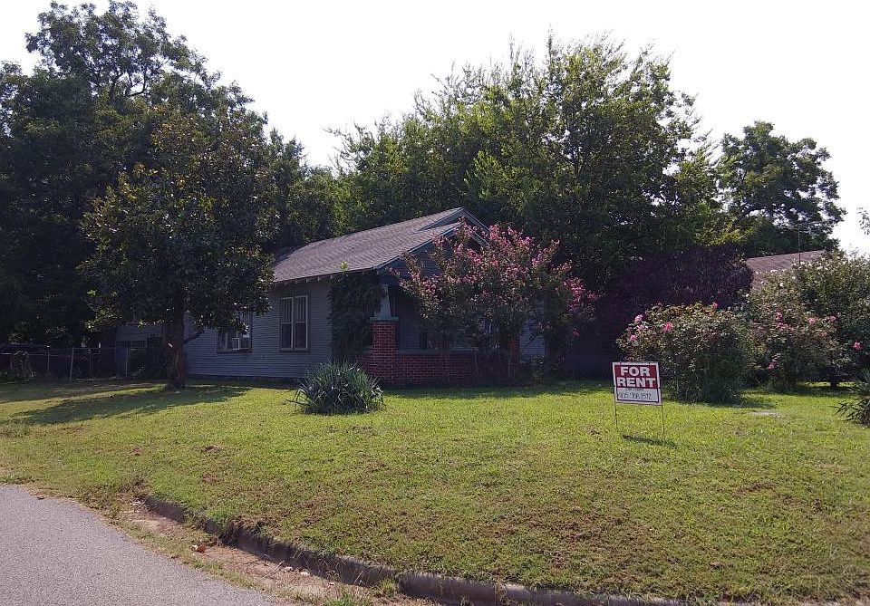 Exterior view - large corner lot. Shaded & fenced back yard with driveway for off street parking.