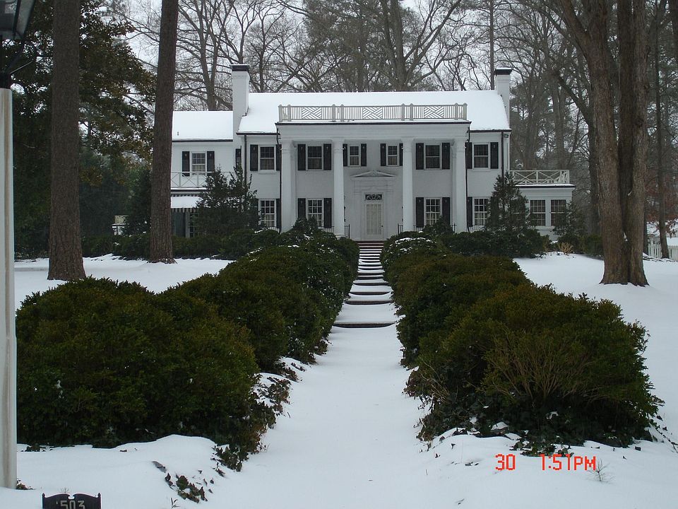 front of home in the snow