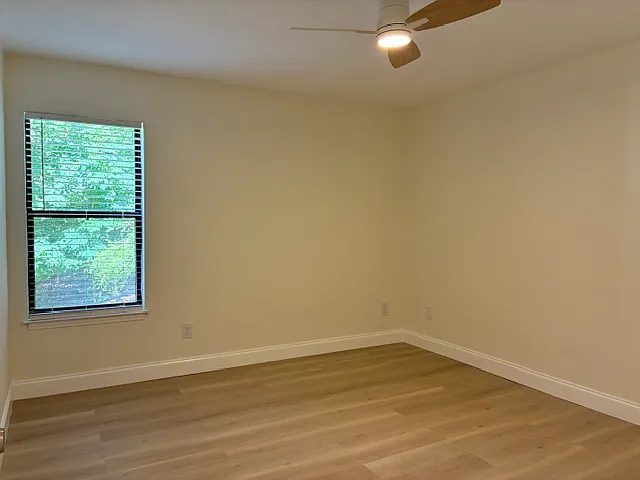 Second bedroom with walk in closet and direct access to a bathroom