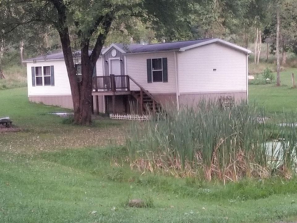 End of street home with a pond