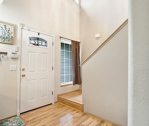 The entry is open & cheery and laminate flooring expands throughout the main level.