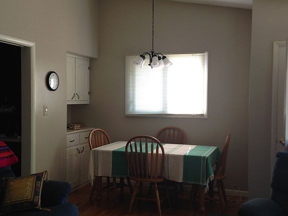The Living Room also has space for an Eating Area............ nice window and light fixture.