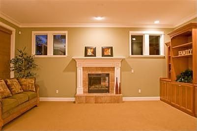 Spacious family room with gas fireplace and custom cabinetry.