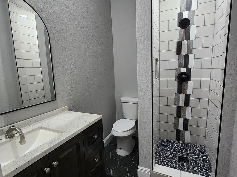 Bathroom in middle Bedroom.
Quartz countertops and Tile floor