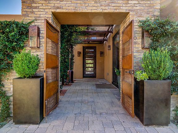 Front entry to this luxury home with a courtyard