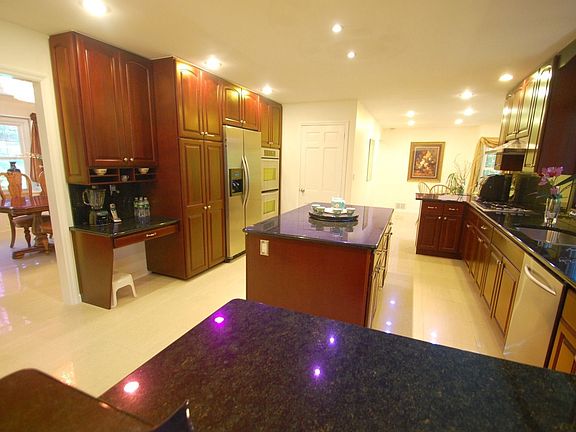 Kitchen - porcelain tile floor, cherry wood cabinets