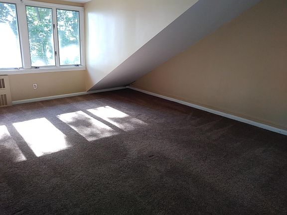 Bedroom with wall to wall carpet.