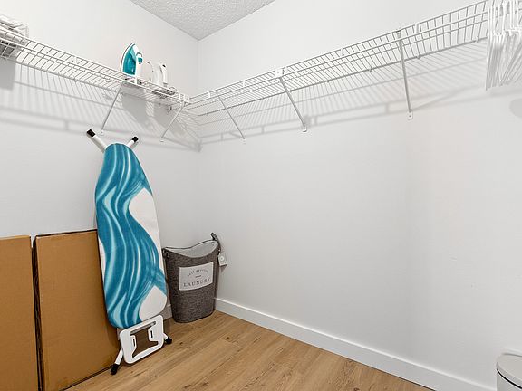 walk in closet in primary bedroom