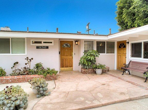 The inviting front entry way with updated exterior light fixtures.
