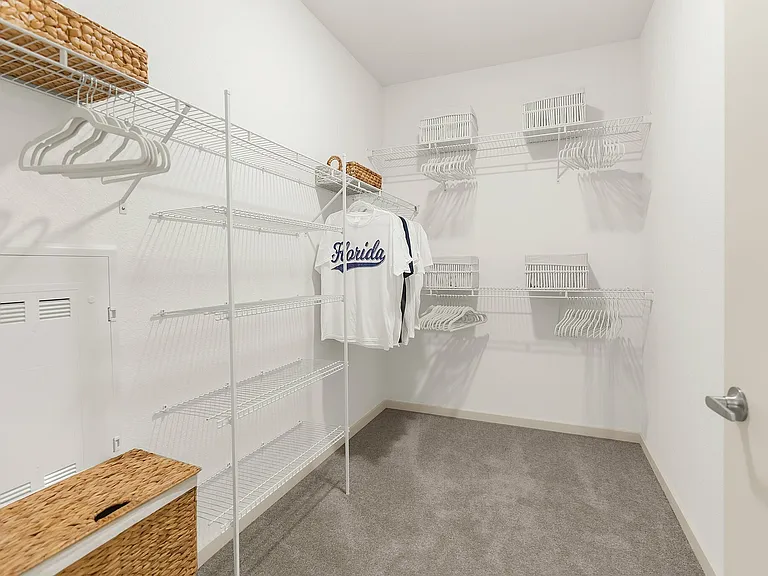 Explore this spacious walk-in closet designed for optimal organization.