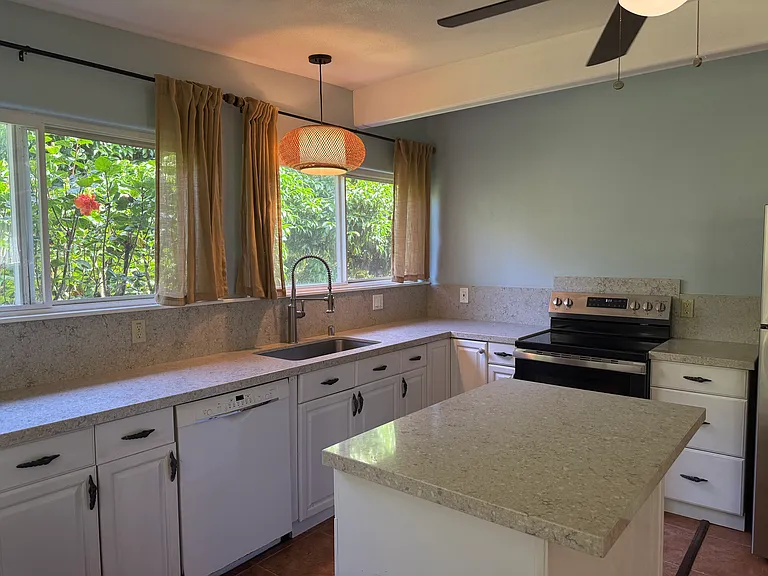 Kitchen comes with dishwasher, stove, and refrigerator.