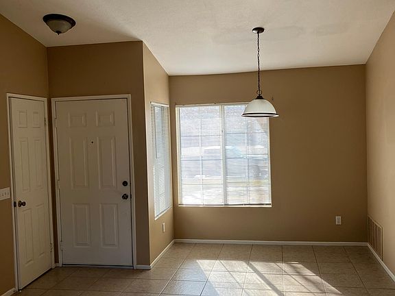 Dining area/front door and coat closet.