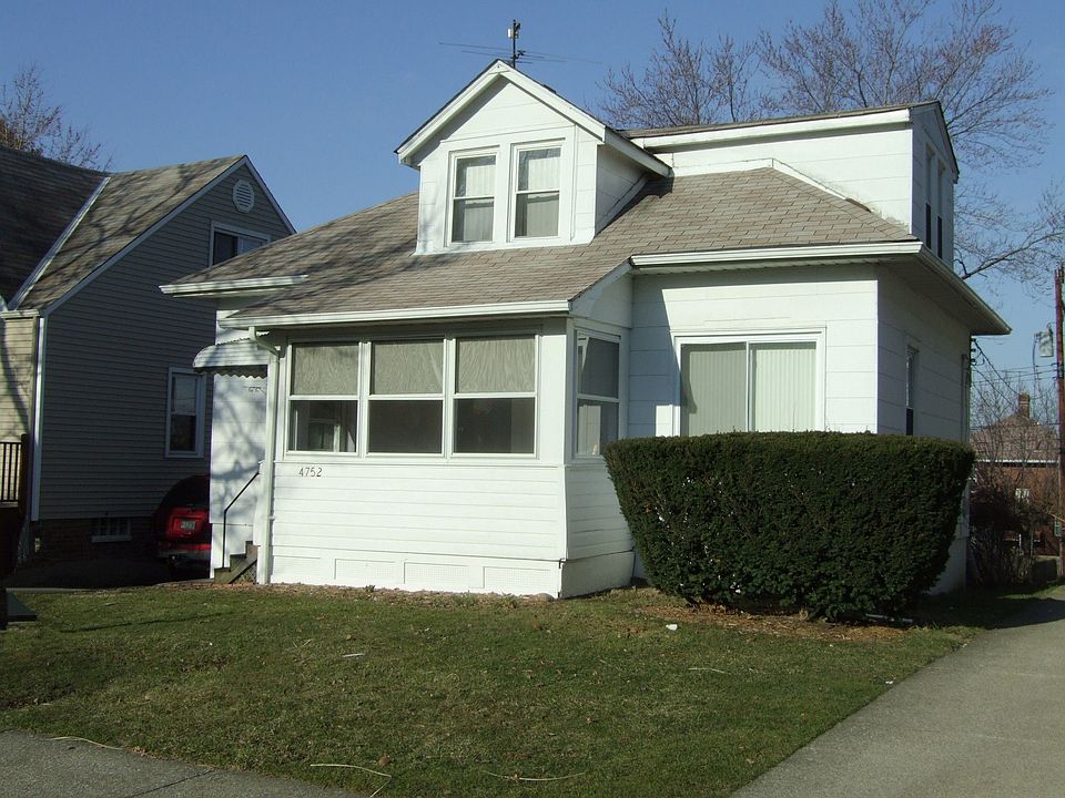 This sweet home has an enclosed front porch
