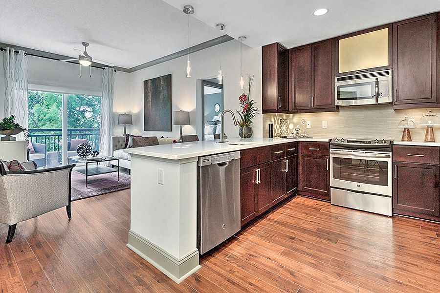 Kitchens with quartz countertops and stainless steel appliances