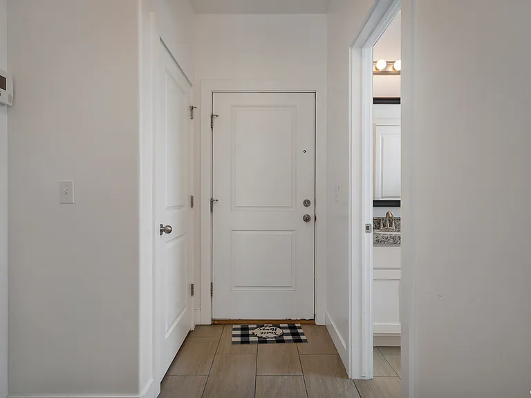 Entryway leading into the kitchen and family room.