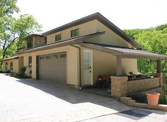Stamped driveway with covered patio.