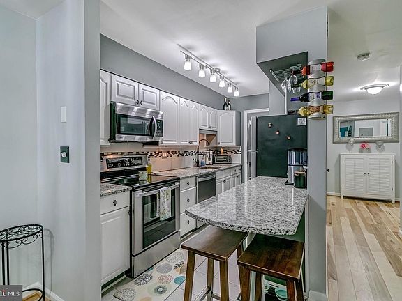 Remodeled kitchen, granite counter tops, newer appliances, wine rack and plenty of storage space