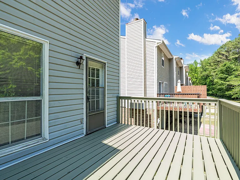 Expansive newly rebuilt deck offers plenty of room for grilling, lounging, and outdoor dining