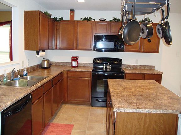 Plenty of gorgeous counter tops and overflowing with cabinetry.  
