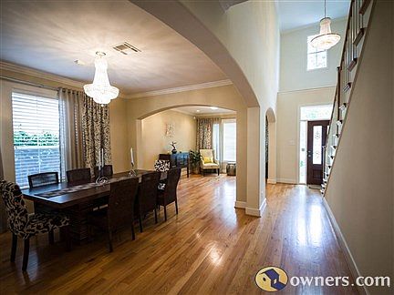 Open plan with gleaming hardwood floors