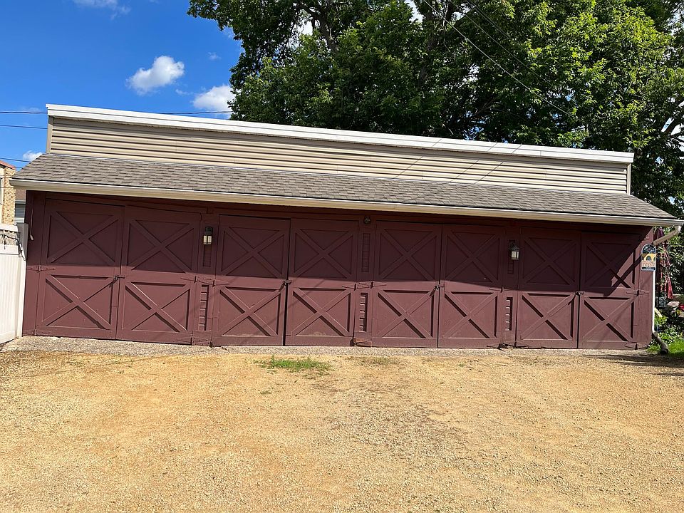 Parking Area with Garages. Rental unit is 3rd pair of doors from the left.