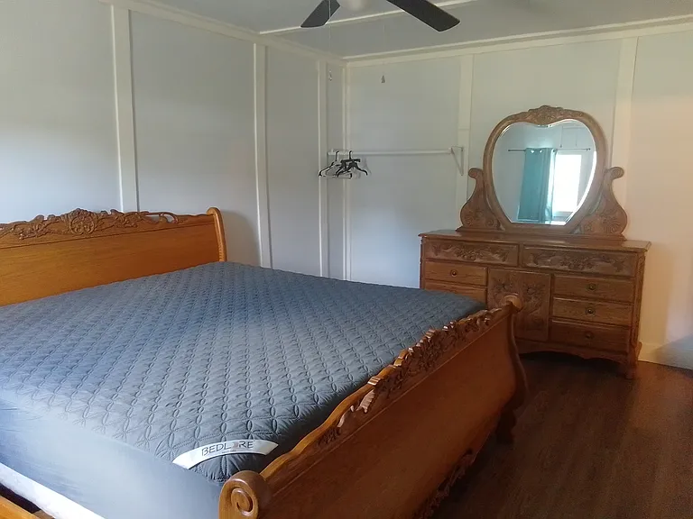 Bedroom comes with a king size bed.