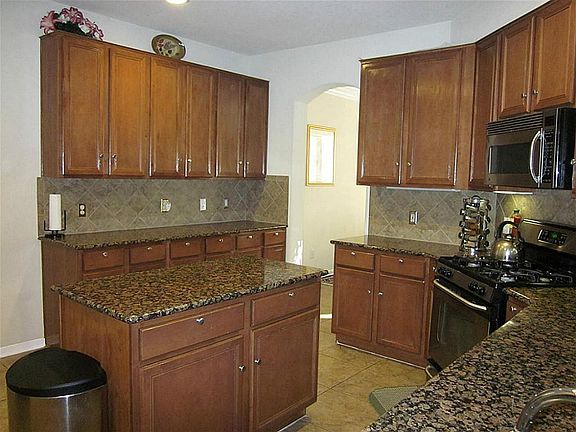 Gourmet island kitchen boasts gorgeous granite counter tops!
