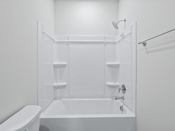 A full bathroom is located next to the first floor bedroom.